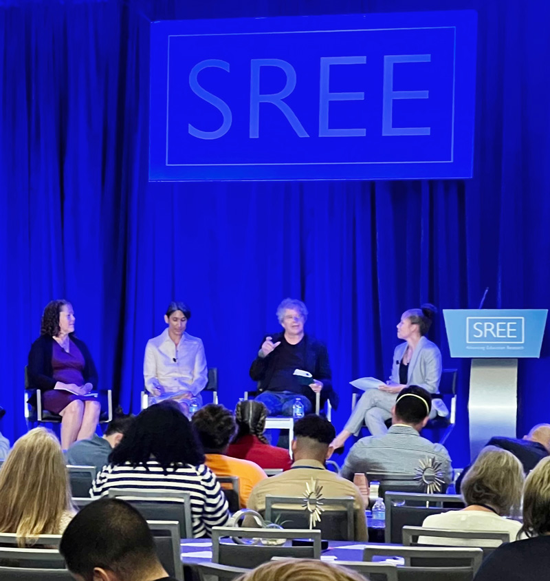 left to right: Dr. Beth Boulay, Dr. Rekha Balu, Dr. Sean Reardon, and Titilola Harley on stage at SREE